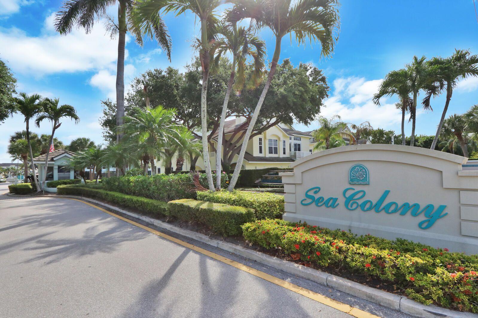 2033 Staysail Lane Jupiter, FL 33477 - Photo 16 of 40 a front view of a house with a yard and potted plants