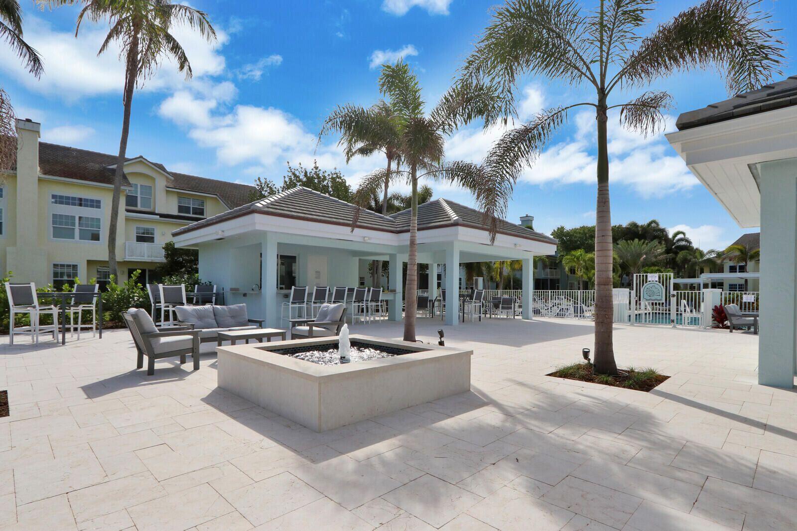 2033 Staysail Lane Jupiter, FL 33477 - Photo 21 of 40 a view of a patio with swimming pool table and chairs