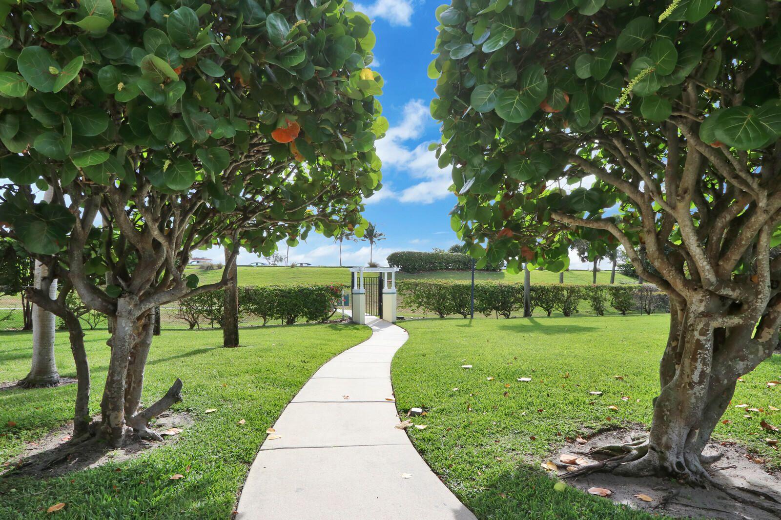 2033 Staysail Lane Jupiter, FL 33477 - Photo 27 of 40 a view of a garden with a tree