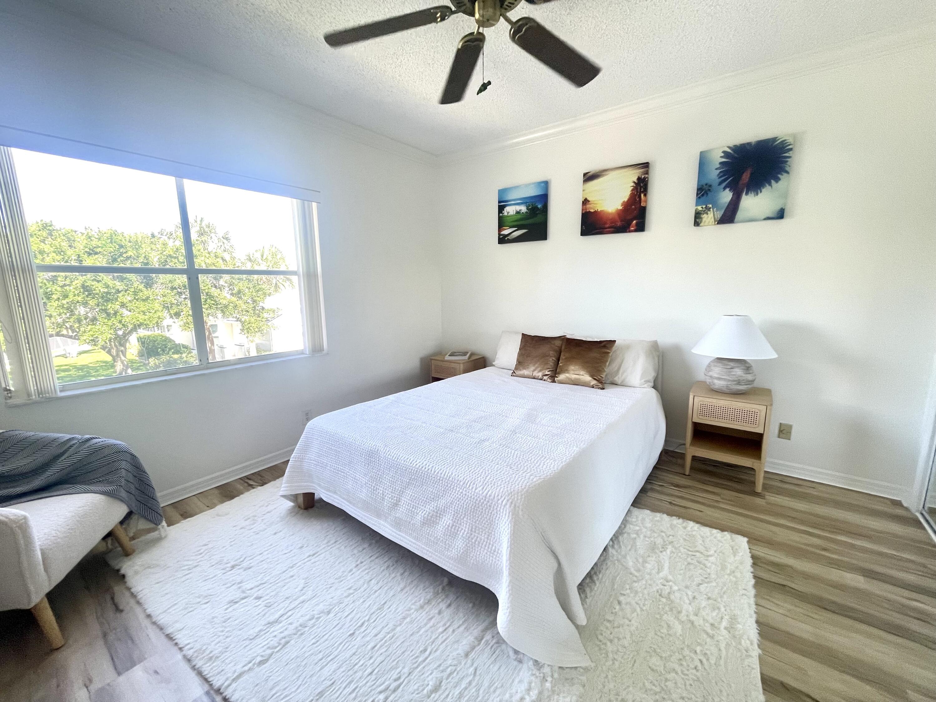 2033 Staysail Lane Jupiter, FL 33477 - Photo 9 of 40 a bedroom with a bed and window