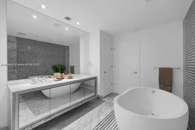 a view of bathroom with dual sinks