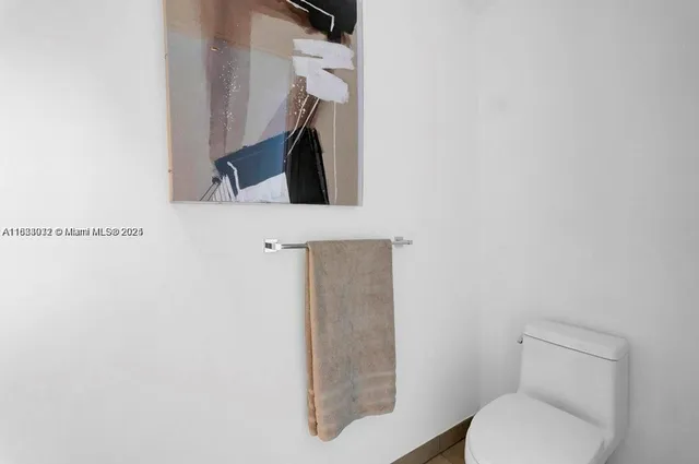 a bathroom with a toilet and a sink