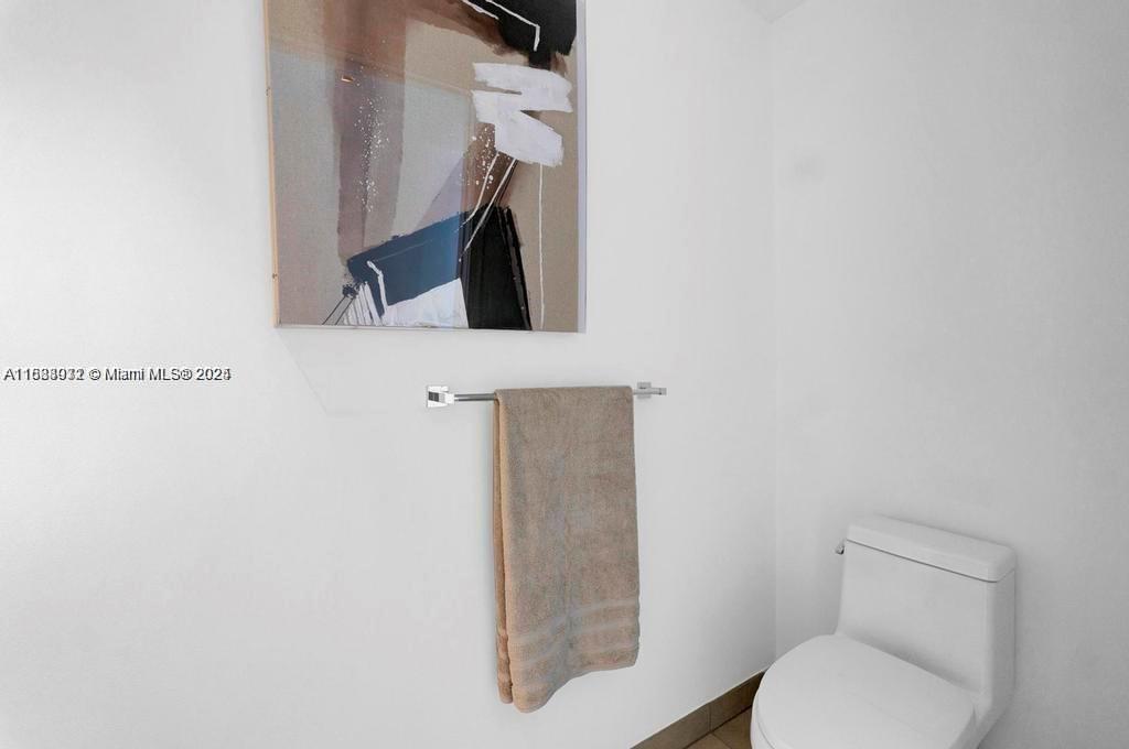 788 Northeast 23rd Street, Unit 1402 Miami, FL 33137 - Photo 23 of 42 a bathroom with a toilet and a sink