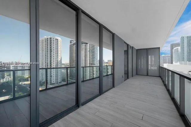 a view of hallway with a balcony