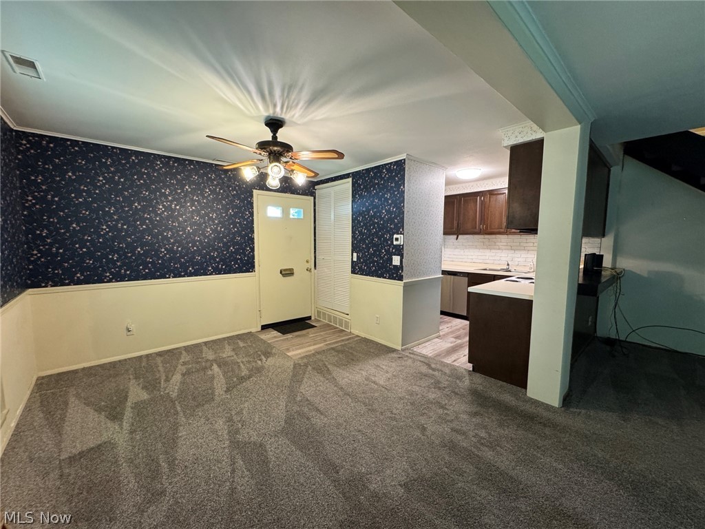 7294 Fox Mill Road, Unit 19D Mentor, OH 44060 - Photo 9 of 27 Spacious room featuring carpeting, ceiling fan and entryway