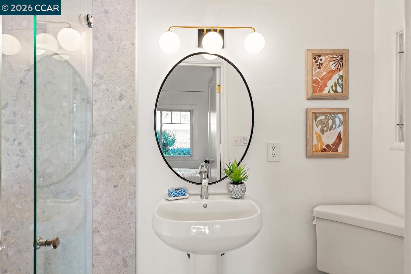 85 Ardmore Road Kensington, CA 94707 - Photo 37 of 45 a bathroom with a toilet a sink and a mirror