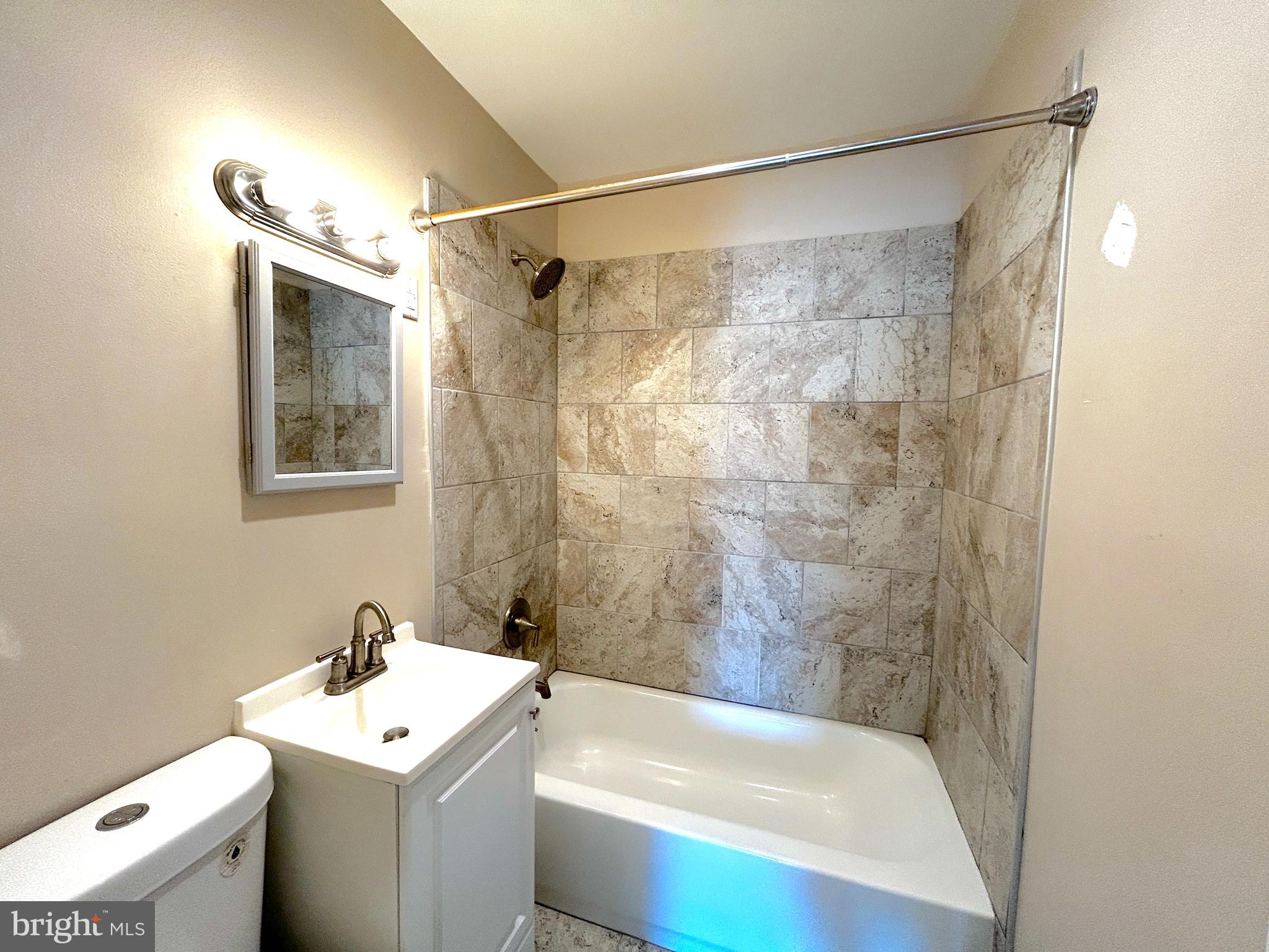 15 Level Road, Unit 5 Collegeville, PA 19426 - Photo 7 of 10 a bathroom with a sink and a bathtub