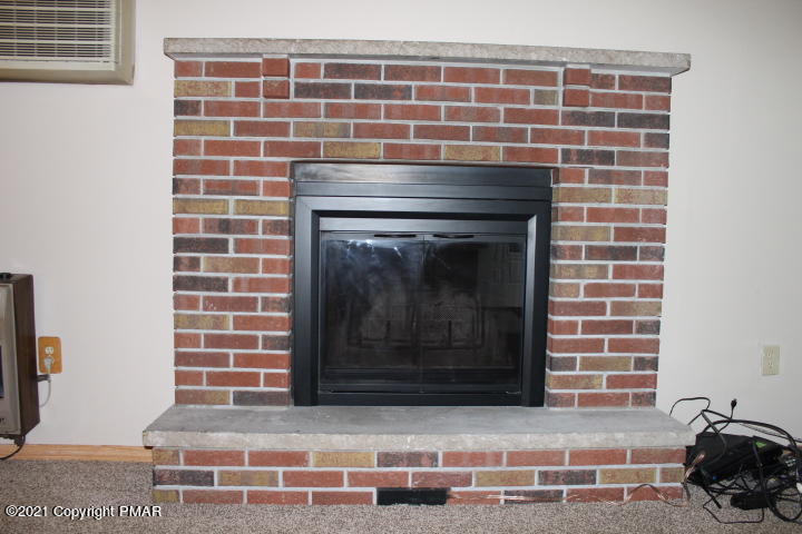 709 Edgewood Road Tobyhanna, PA 18466 - Photo 14 of 55 a living room with a fireplace
