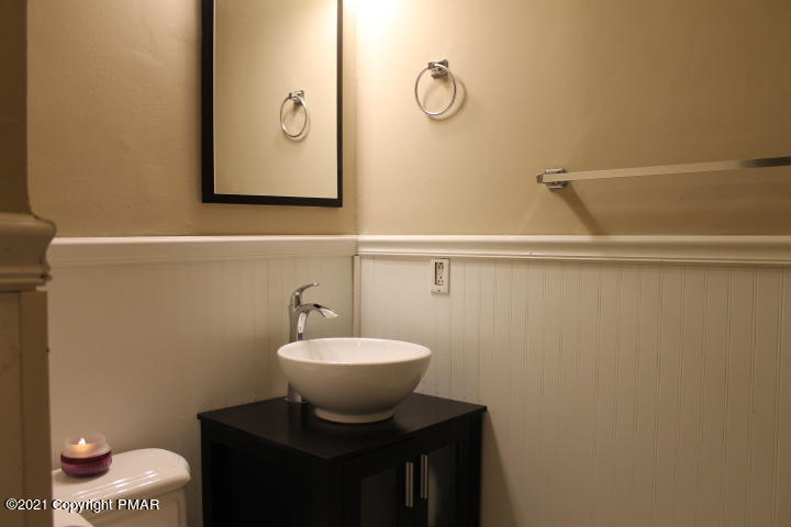 709 Edgewood Road Tobyhanna, PA 18466 - Photo 23 of 55 a bathroom with a toilet sink and mirror