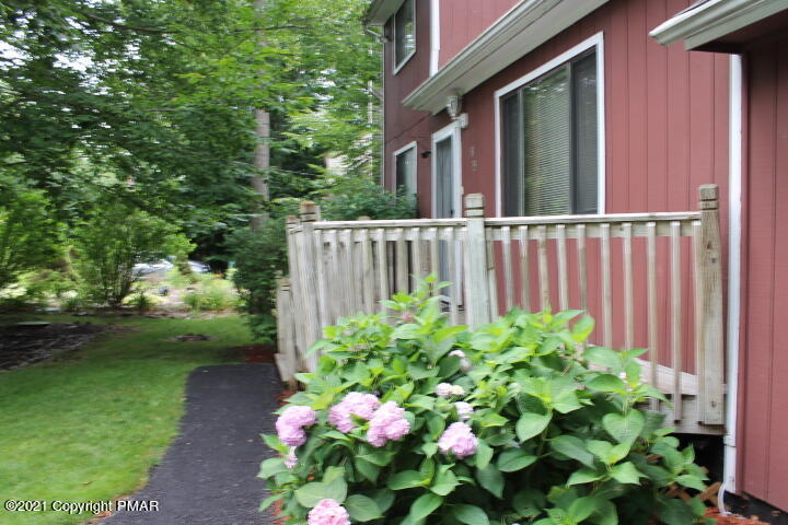 709 Edgewood Road Tobyhanna, PA 18466 - Photo 3 of 55 a green field with flowers in front of it