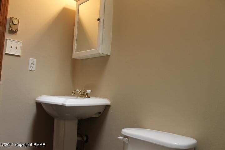 709 Edgewood Road Tobyhanna, PA 18466 - Photo 33 of 55 a bathroom with a sink and a toilet
