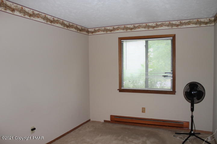 709 Edgewood Road Tobyhanna, PA 18466 - Photo 39 of 55 a room with a window and a table