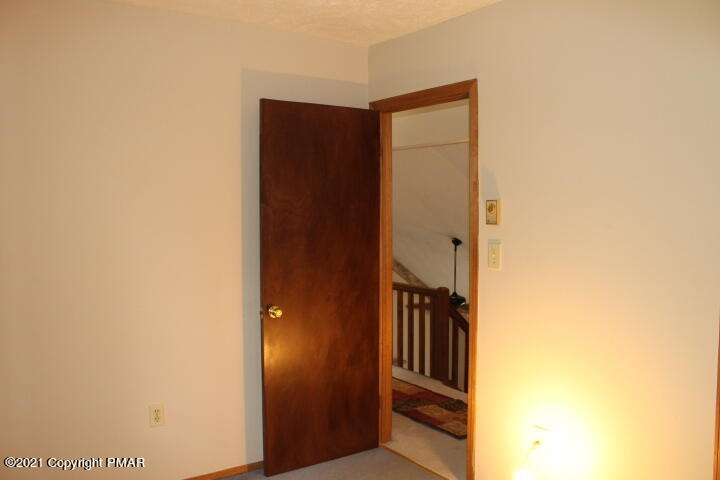 709 Edgewood Road Tobyhanna, PA 18466 - Photo 40 of 55 a view of a hallway with wooden floor