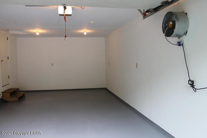 709 Edgewood Road Tobyhanna, PA 18466 - Photo 45 of 55 a view of a room with stainless steel appliances wooden floor and chairs