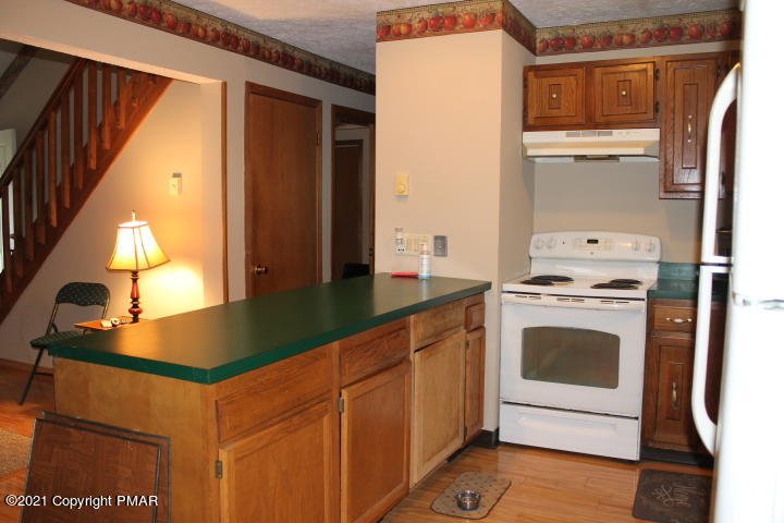 709 Edgewood Road Tobyhanna, PA 18466 - Photo 5 of 55 a kitchen with stainless steel appliances granite countertop a stove and a refrigerator