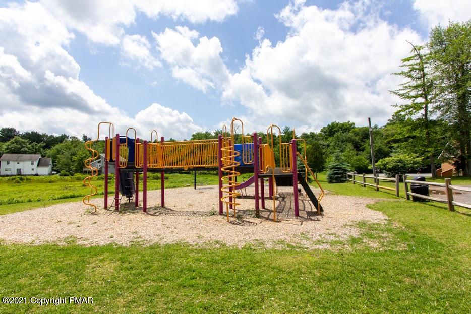 709 Edgewood Road Tobyhanna, PA 18466 - Photo 54 of 55 a view of a park with swings and slides