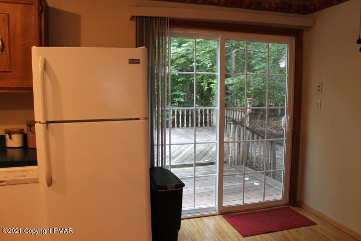 709 Edgewood Road Tobyhanna, PA 18466 - Photo 8 of 55 a white refrigerator freezer and a stove sitting inside of a kitchen