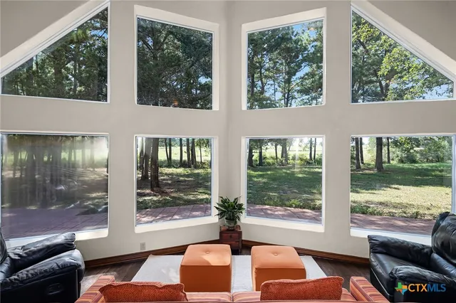 a living room with furniture and windows