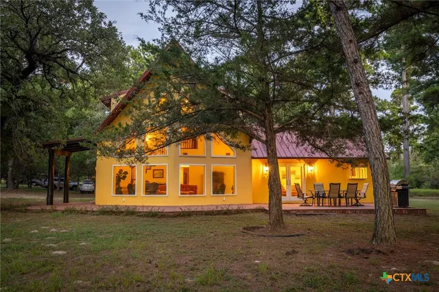 a front view of a house with a big yard