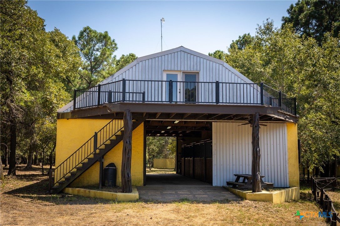 1031 Angel Lake Estates Road Alleyton, TX 78935 - Photo 19 of 47 a view of a house with wooden stairs