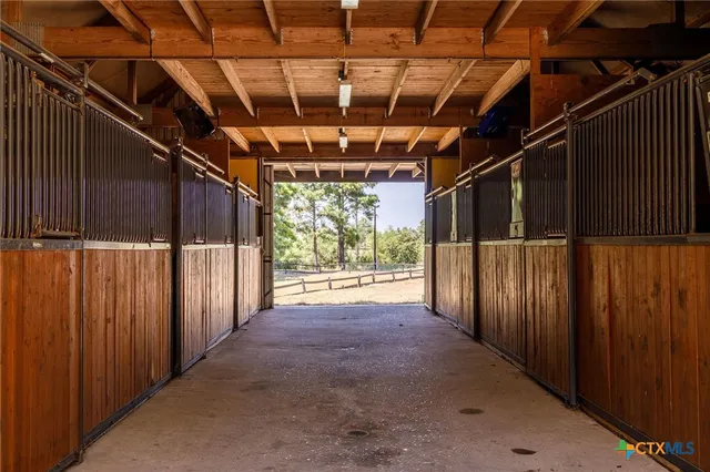 a view of water heater room with stairs
