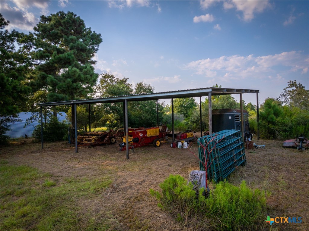 1031 Angel Lake Estates Road Alleyton, TX 78935 - Photo 27 of 47 a view of a bench in a backyard