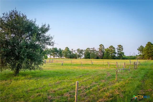 a backyard of a house with a lake view