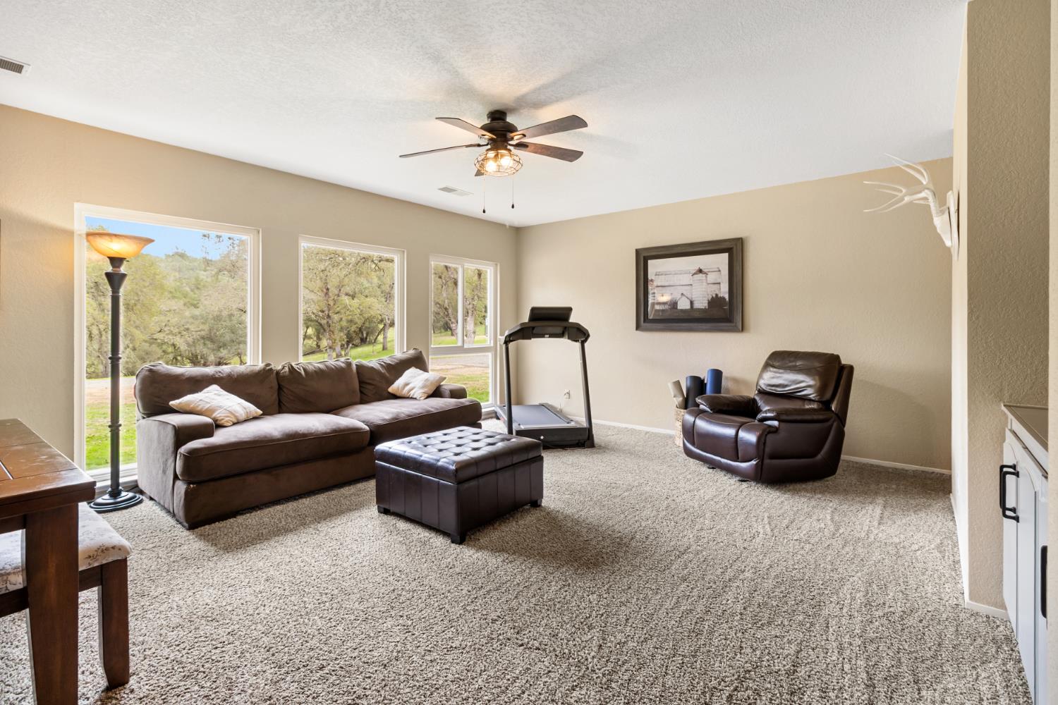 22800 Latrobe Road Plymouth, CA 95669 - Photo 14 of 81 a living room with furniture and a large window