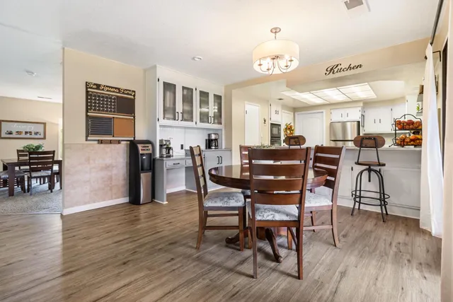 a bathroom with a granite countertop sink and a toilet