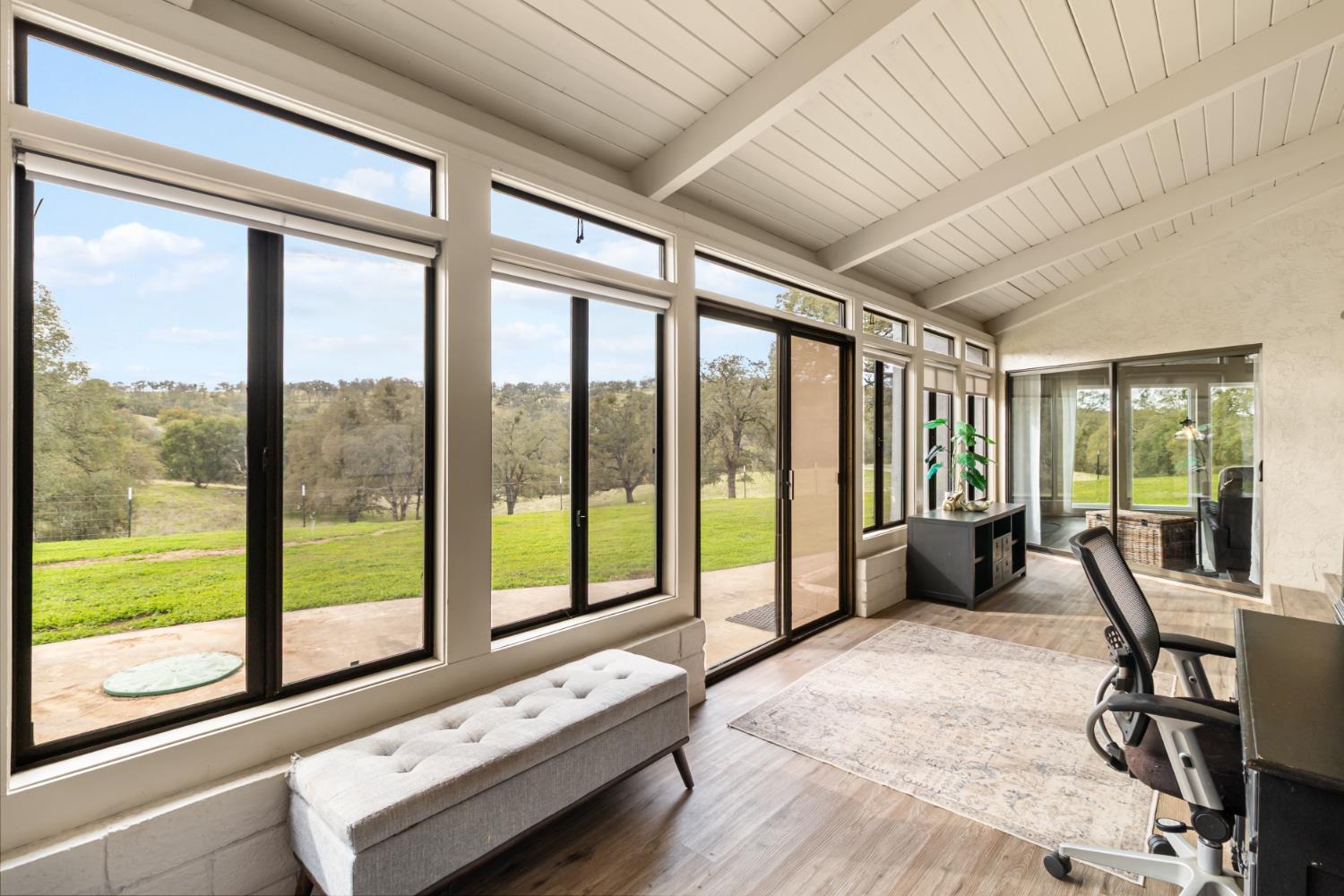 22800 Latrobe Road Plymouth, CA 95669 - Photo 27 of 81 a living room with furniture and floor to ceiling windows