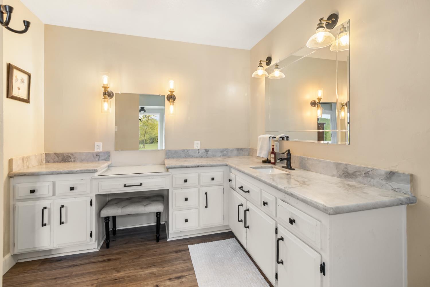 22800 Latrobe Road Plymouth, CA 95669 - Photo 30 of 81 a spacious bathroom with a granite countertop sink and a mirror