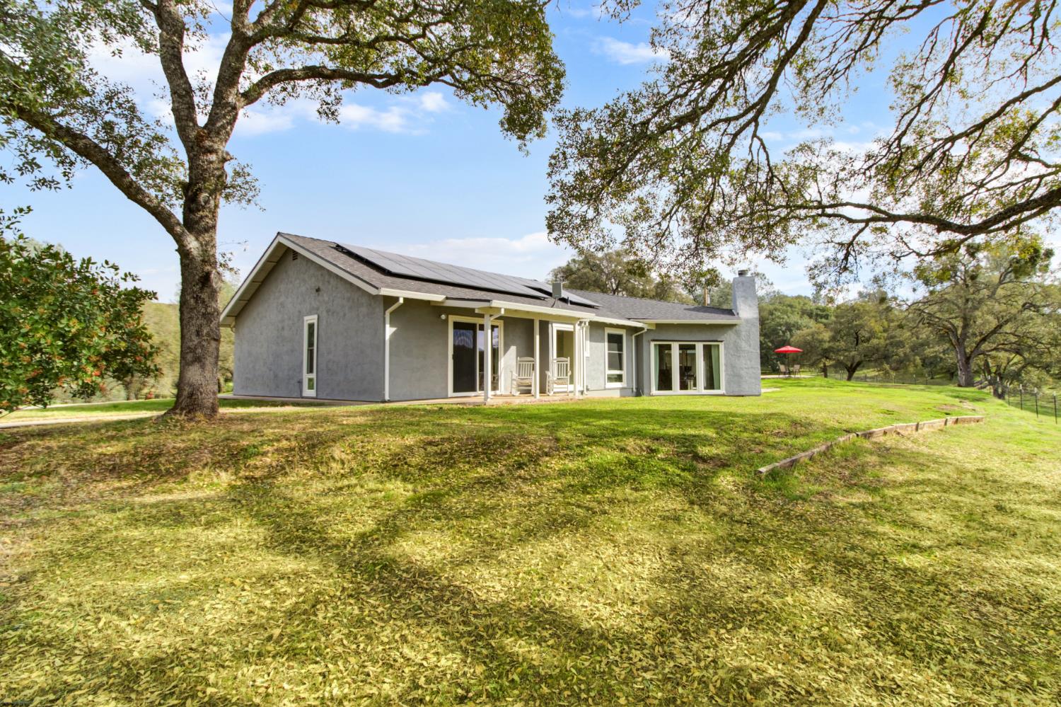 22800 Latrobe Road Plymouth, CA 95669 - Photo 3 of 81 a front view of house with yard and trees around
