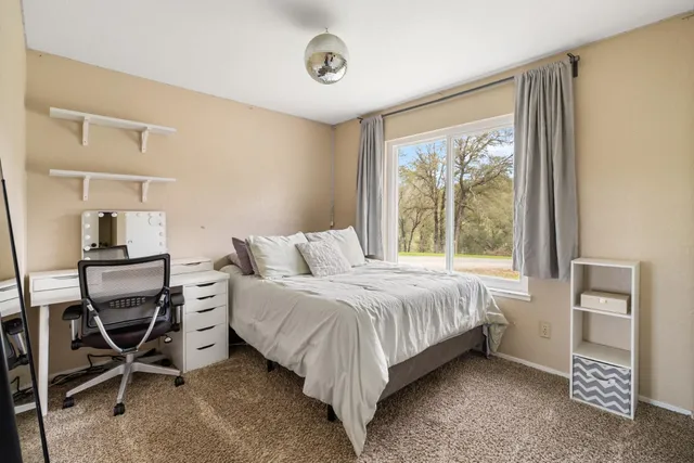 a kitchen with granite countertop stainless steel appliances a refrigerator sink microwave and cabinets