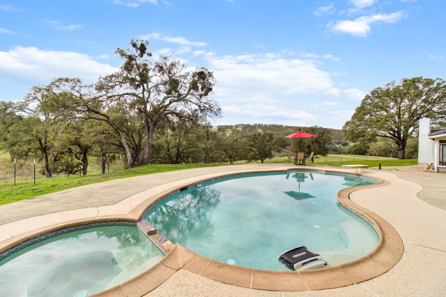 22800 Latrobe Road Plymouth, CA 95669 - Photo 39 of 81 a view of a swimming pool with a yard