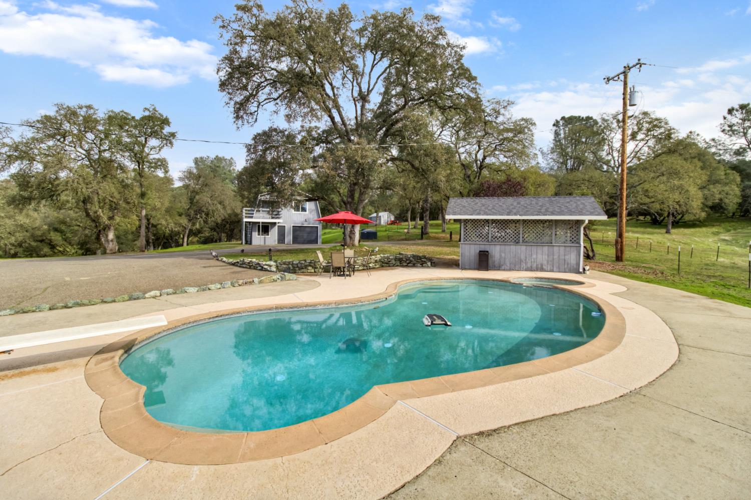 22800 Latrobe Road Plymouth, CA 95669 - Photo 40 of 81 a view of a swimming pool with a yard and sitting area