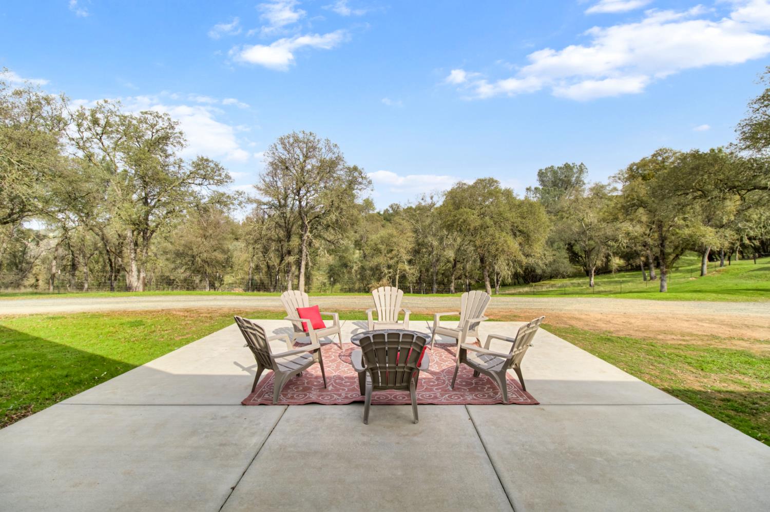 22800 Latrobe Road Plymouth, CA 95669 - Photo 44 of 81 a view of a patio with a table and chairs under an umbrella