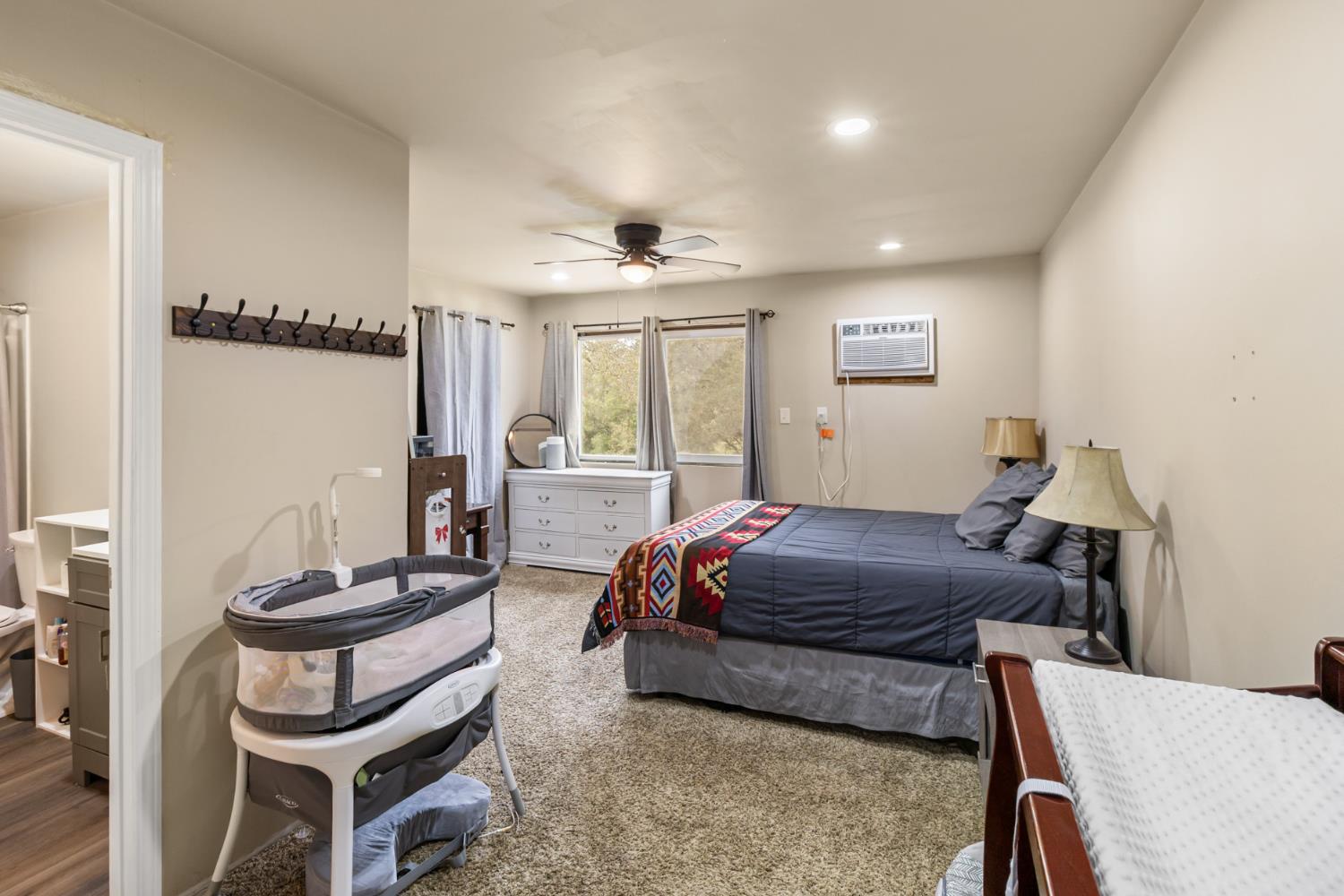 22800 Latrobe Road Plymouth, CA 95669 - Photo 51 of 81 a living room with a bed and a window