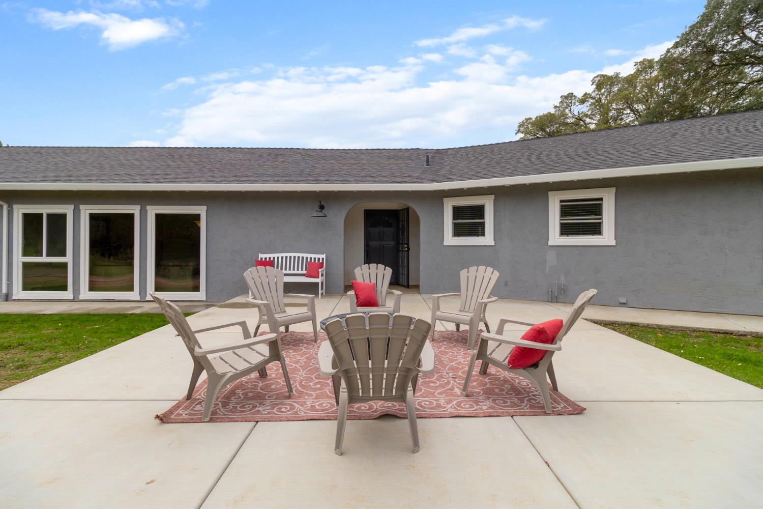 22800 Latrobe Road Plymouth, CA 95669 - Photo 7 of 81 a view of a patio with table and chairs and potted plants