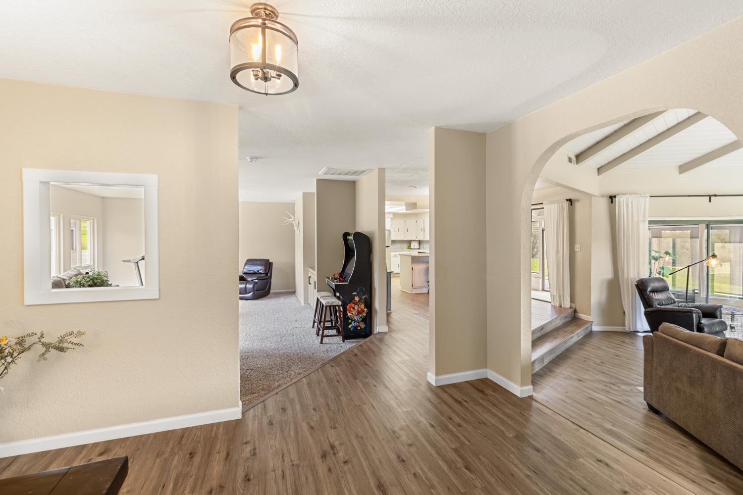 22800 Latrobe Road Plymouth, CA 95669 - Photo 10 of 81 a view of a room with wooden floor and furniture