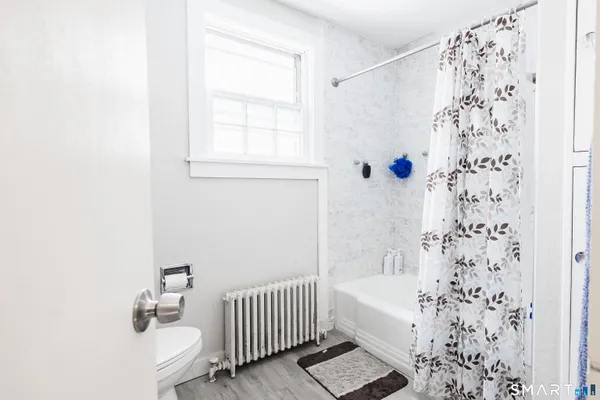 a bathroom with a bathtub and shower