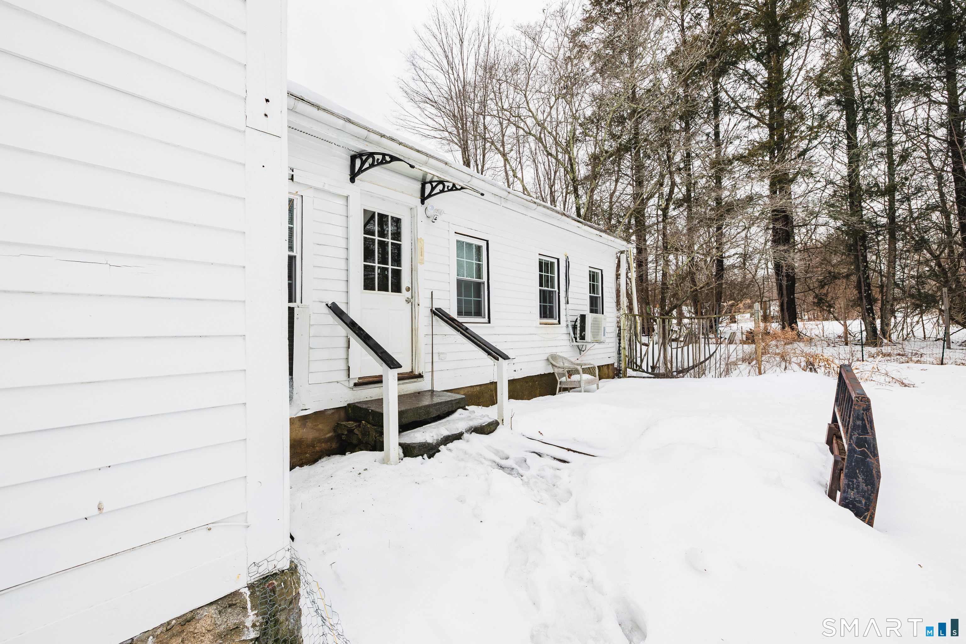 934 Storrs Road Mansfield, CT 06268 - Photo 23 of 24 a view of a house with snow on the road