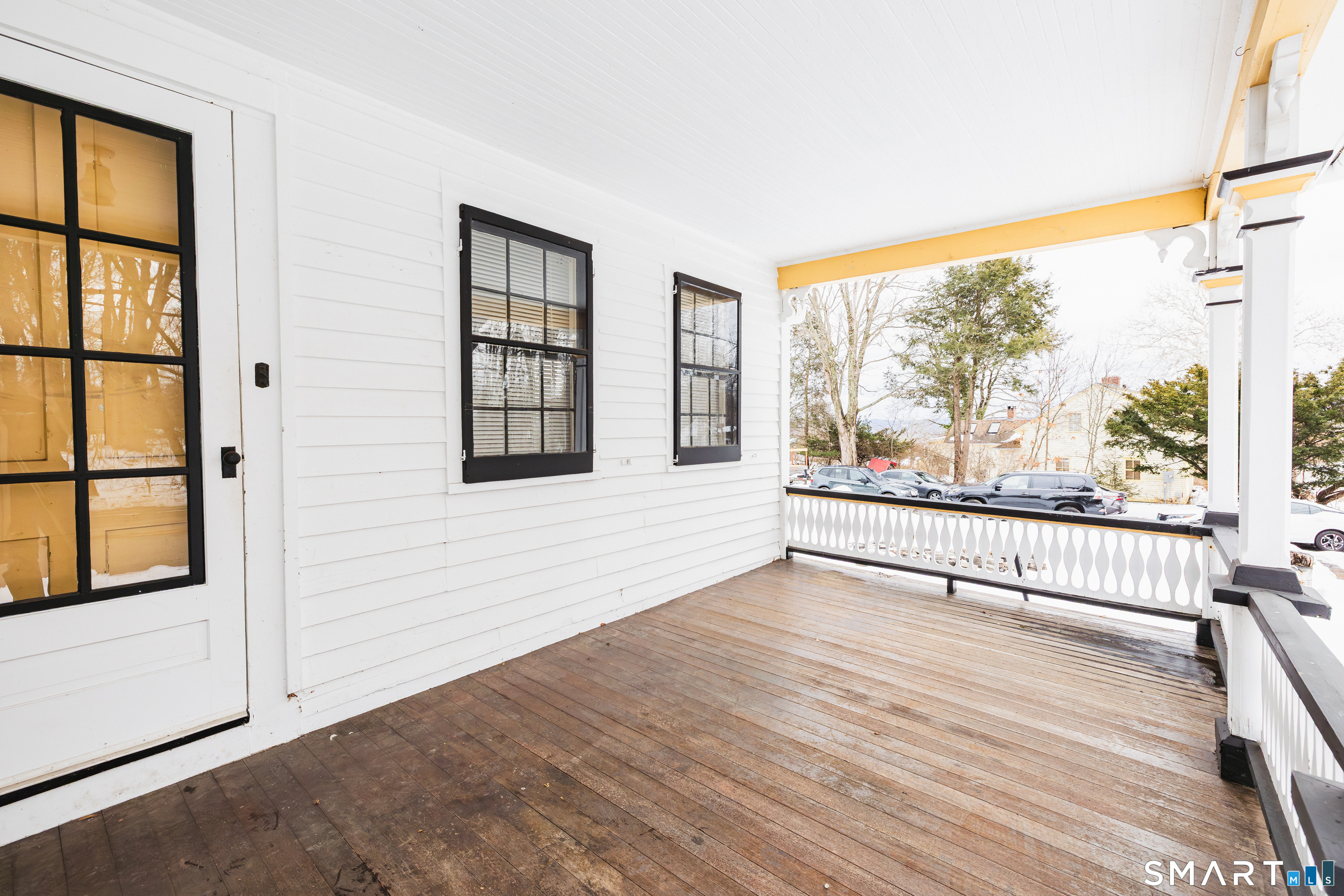 934 Storrs Road Mansfield, CT 06268 - Photo 3 of 24 an empty room with wooden floor and windows
