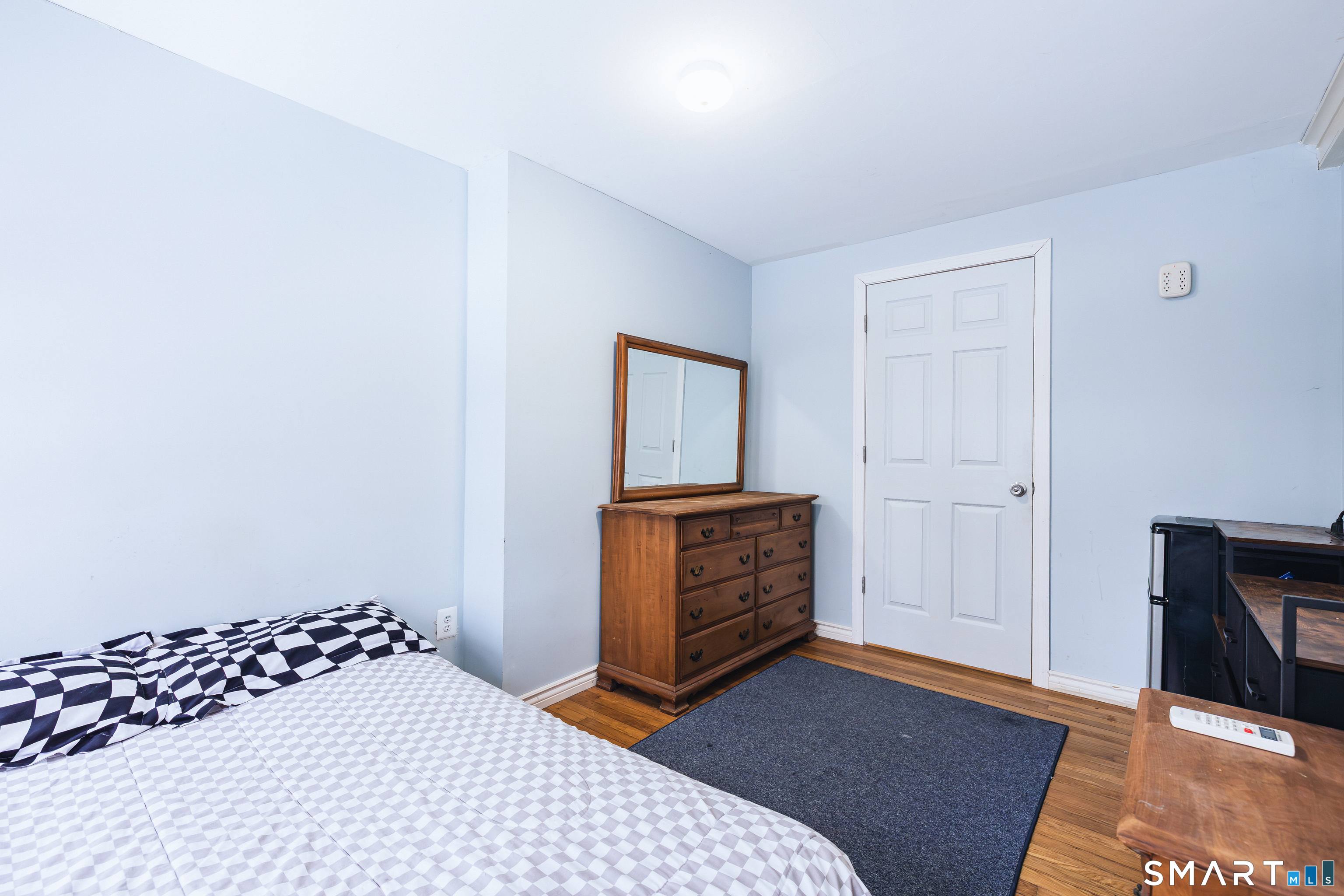 934 Storrs Road Mansfield, CT 06268 - Photo 6 of 24 a bedroom with a bed and wooden floor