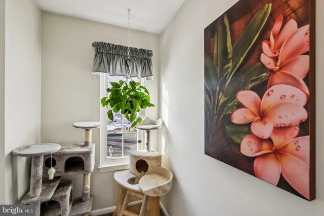 a table with a vase and flowers on it