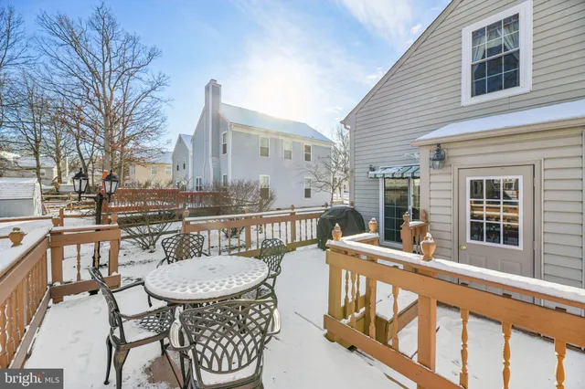 a view of a balcony with table and chairs
