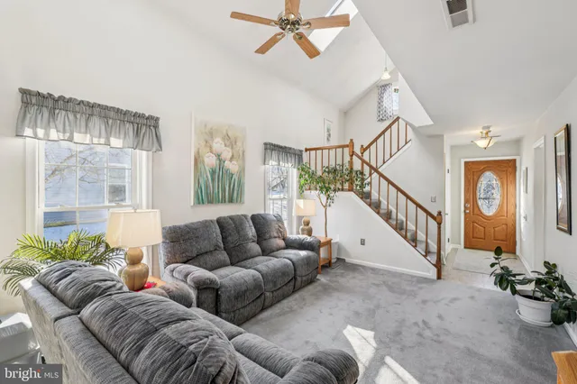 a living room with furniture and white walls