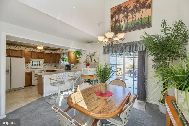 a kitchen with a table and chairs in it