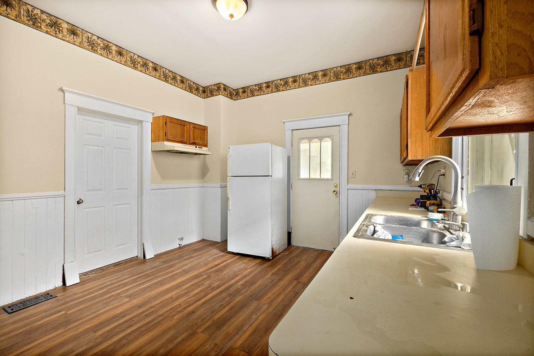 8 Saragossa Street St. Augustine, FL 32084 - Photo 11 of 38 a bedroom with a bed and wooden floor