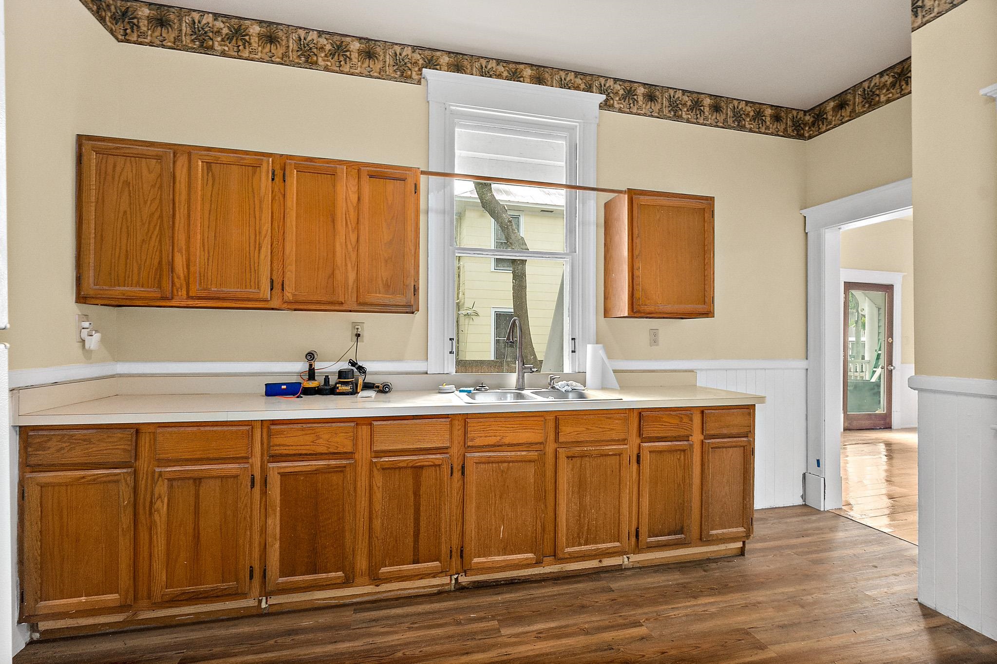 8 Saragossa Street St. Augustine, FL 32084 - Photo 13 of 38 a kitchen with a sink and cabinets