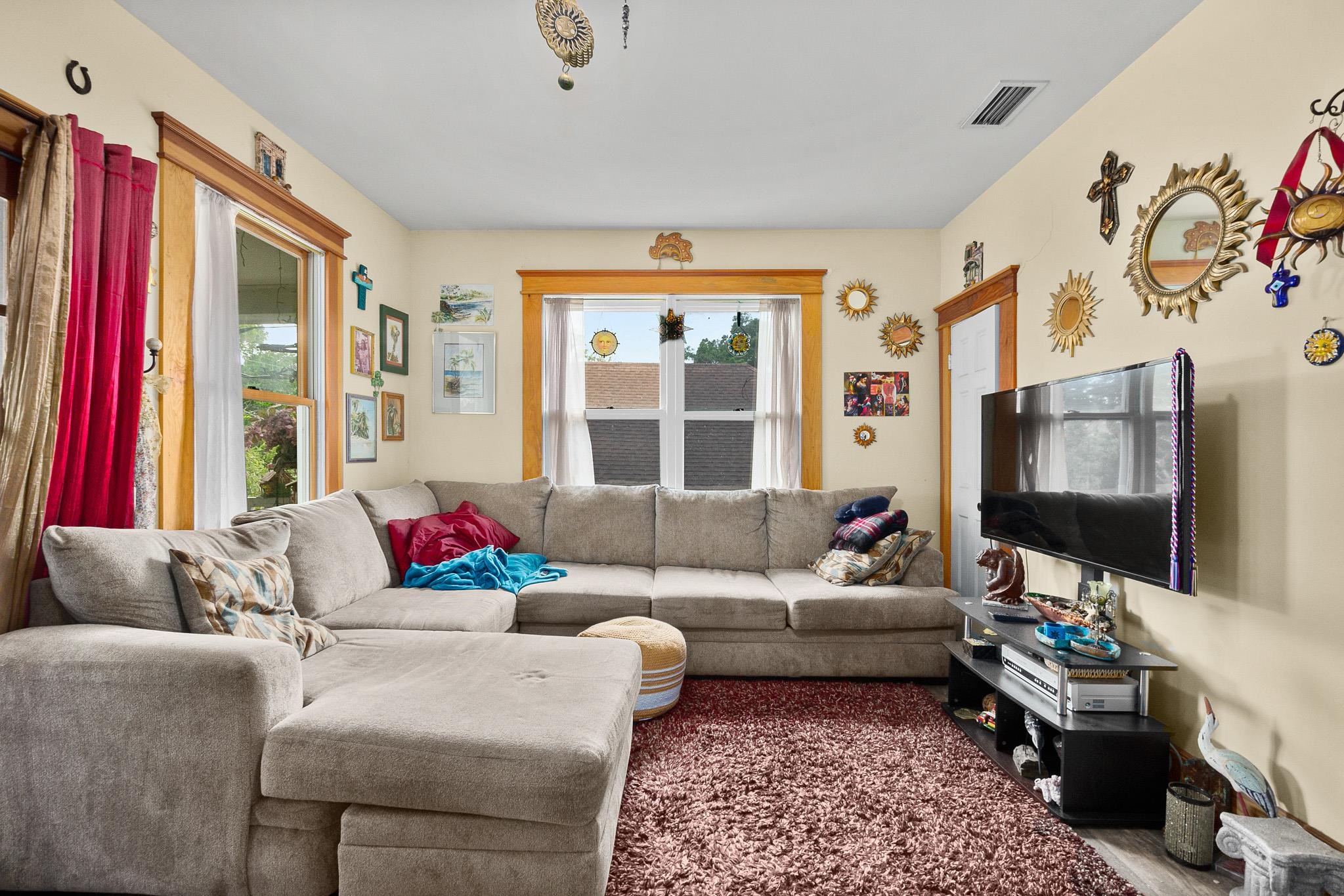 8 Saragossa Street St. Augustine, FL 32084 - Photo 20 of 38 a living room with furniture and a flat screen tv